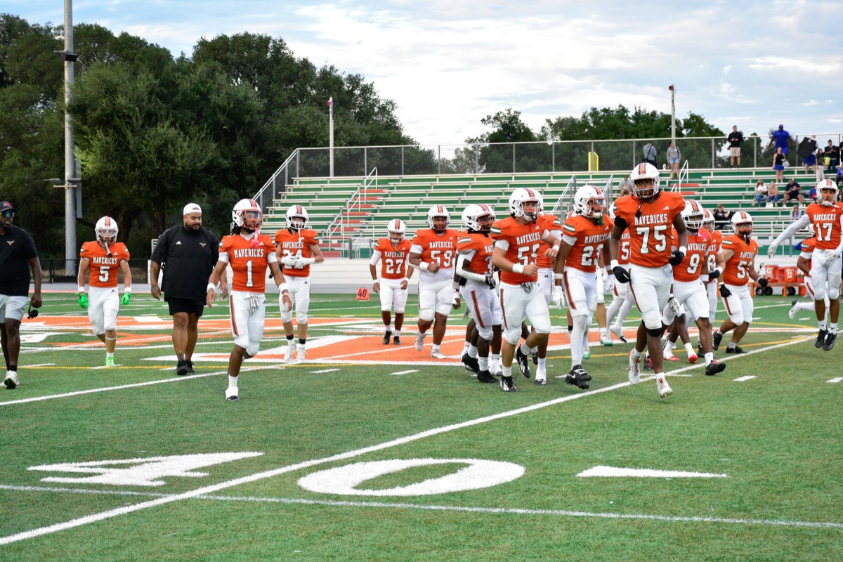 Take the field. Orange jerseys, green bleachers, home turf.